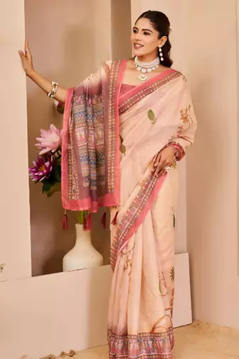 Peach shimmer printed zari saree with unstitched blouse piece.