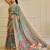 Sea green shimmer printed zari saree with unstitched blouse piece.