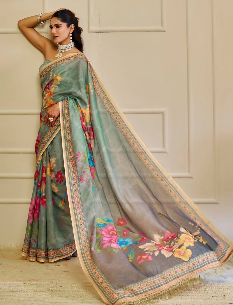 Sea green shimmer printed zari saree with unstitched blouse piece.