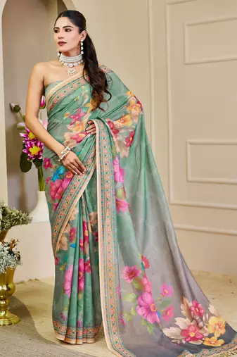 Sea green shimmer printed zari saree with unstitched blouse piece.