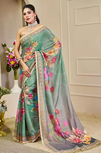Sea green shimmer printed zari saree with unstitched blouse piece.