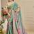 Sea green shimmer printed zari saree with unstitched blouse piece.