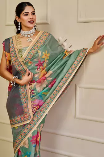 Sea green shimmer printed zari saree with unstitched blouse piece.