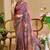 Wine shimmer printed zari saree with unstitched blouse piece.