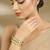 Gold plated mint green oval stones bangles