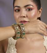 Gold plated green stones polki bangles