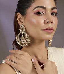 Gold plated white motis chandbali  earrings