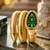 gold plated green dial ad studded spiral watch
