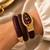 gold plated ad studded brown faux leather watch