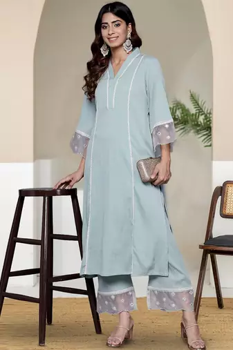 Women Solid Kurta with Trousers
