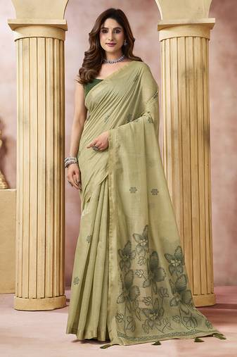 Sage green linen silk blend saree with floral woven pallu & tassels