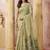 Sage green linen silk blend saree with floral woven pallu & tassels