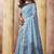 Light blue linen silk blend saree with floral woven pallu & tassels