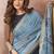 Light blue linen silk blend saree with floral woven pallu & tassels