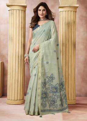 Sage green linen silk blend saree with floral woven pallu & tassels 1