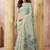 Sage green linen silk blend saree with floral woven pallu & tassels