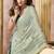 Sage green linen silk blend saree with floral woven pallu & tassels