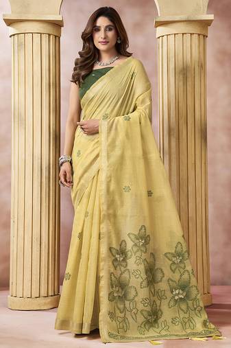 Pastel yellow linen silk blend saree with floral woven pallu & tassels