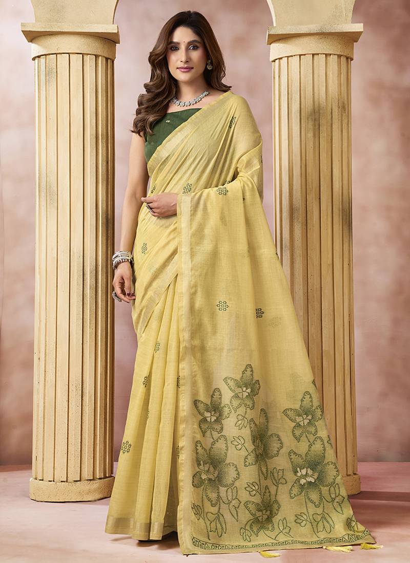 Pastel yellow linen silk blend saree with floral woven pallu & tassels