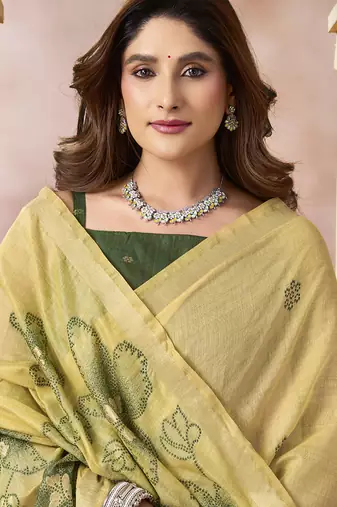 Pastel yellow linen silk blend saree with floral woven pallu & tassels