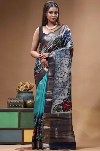 sky blue & navy blue hand-painted silk blend saree with floral batik print & golden zari border