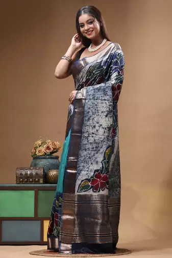 sky blue & navy blue hand-painted silk blend saree with floral batik print & golden zari border