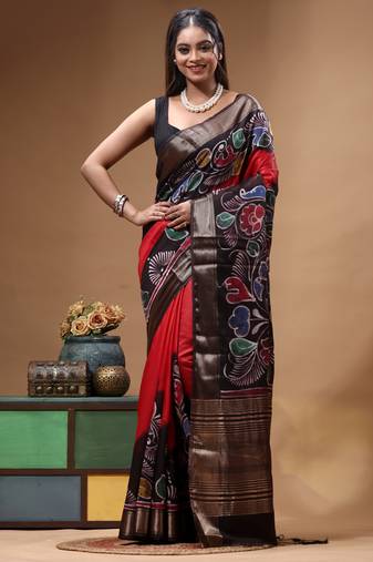 red & black hand-painted silk blend saree with multicolor floral motifs & golden zari border