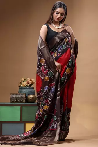 red & black hand-painted silk blend saree with multicolor floral motifs & golden zari border