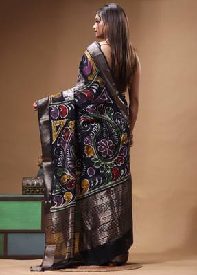 elegant black hand-painted silk blend saree with floral batik print & golden zari border 3