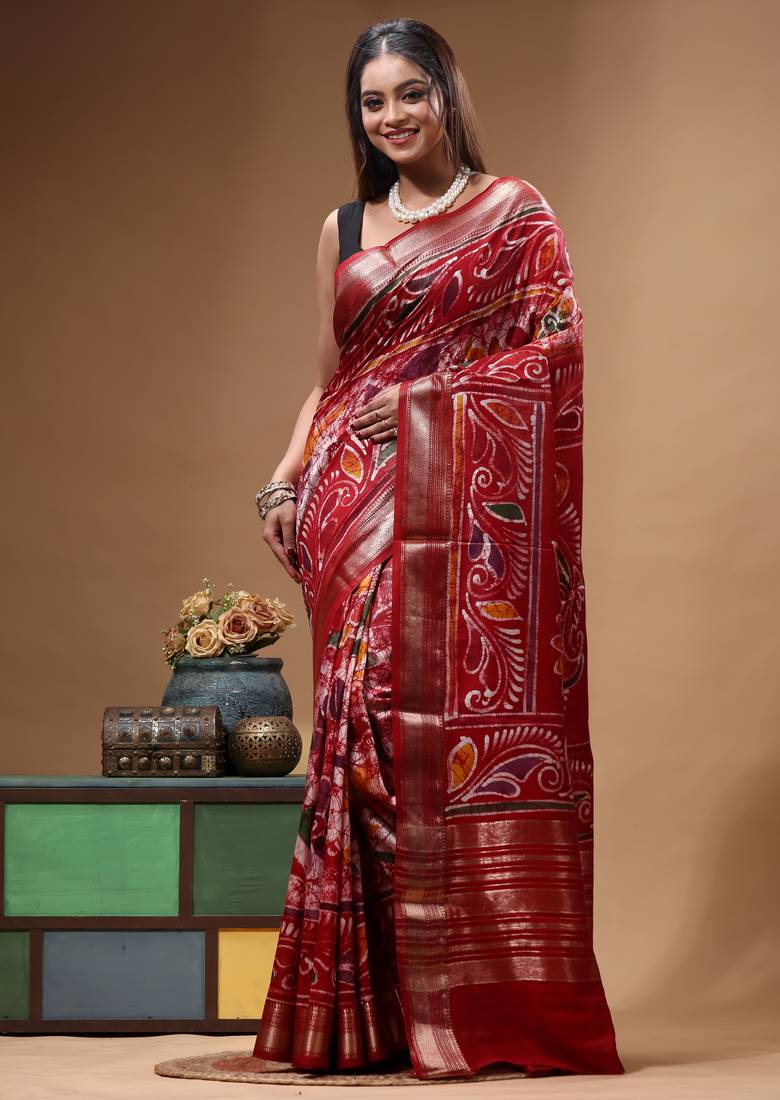elegant maroon hand-painted silk blend saree with floral batik print & rich golden zari border