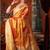 Orange tissue silk blend saree with floral zari border