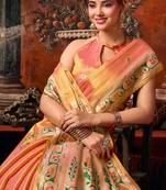 Peach tissue silk blend saree with floral zari border
