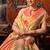 Peach tissue silk blend saree with floral zari border