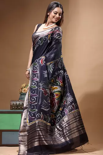 elegant black silk blend saree with hand-painted floral art & rich golden zari border