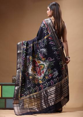 elegant black silk blend saree with hand-painted floral art & rich golden zari border 3