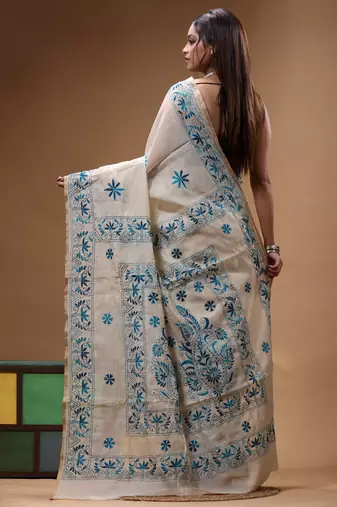 off-white cotton blend saree with blue floral embroidered stitched saree