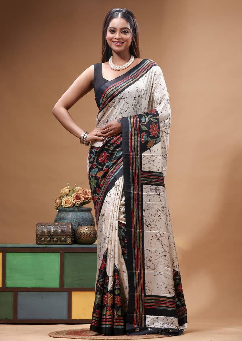 elegant off-white printed silk blend saree with red & black artistic border