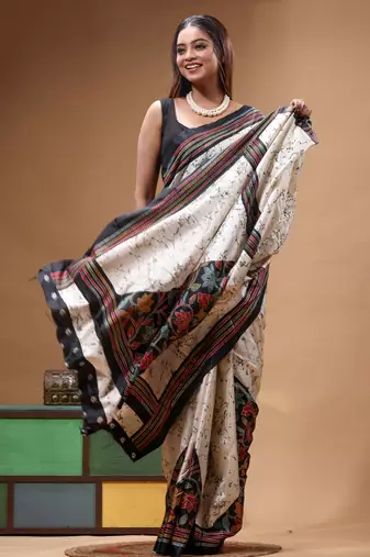 elegant off-white printed silk blend saree with red & black artistic border