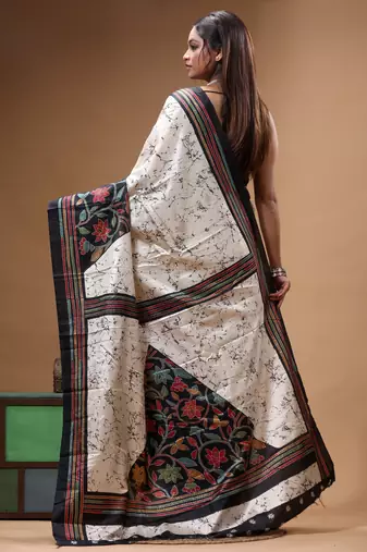 elegant off-white printed silk blend saree with red & black artistic border