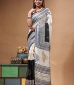 elegant black & off-white printed silk blend saree with geometric & leaf motif