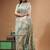 off-white cotton blend saree with teal green floral embroidered stitched saree