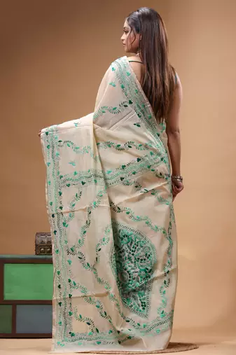 off-white cotton blend saree with teal green floral embroidered stitched saree