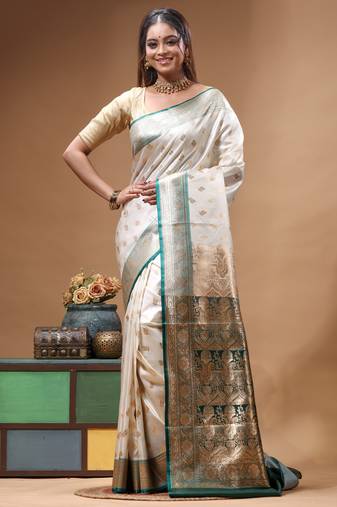 Off-white katan silk saree with gold zari woven border & green contrasting border