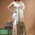 Off-white katan silk saree with gold zari woven border & green contrasting border