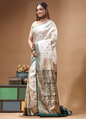 Off-white katan silk saree with gold zari woven border & green contrasting border 2