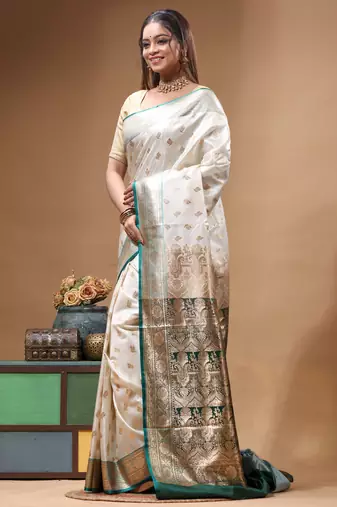 Off-white katan silk saree with gold zari woven border & green contrasting border