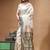 Off-white katan silk saree with gold zari woven border & green contrasting border