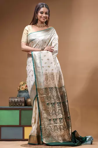 Off-white katan silk saree with gold zari woven border & green contrasting border