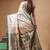Off-white katan silk saree with gold zari woven border & green contrasting border