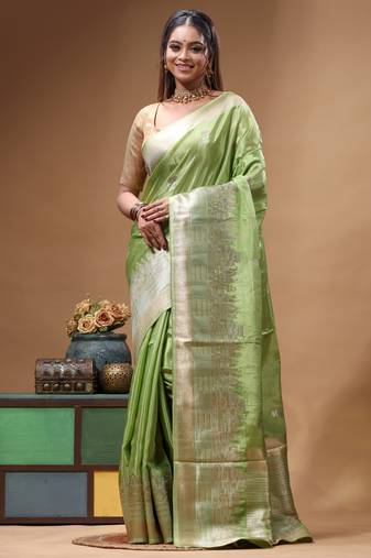 green crepe saree with desighner varanasi ghat theme zari border
